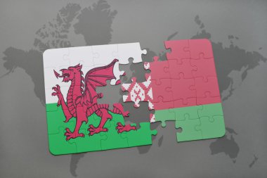 bir dünya haritası arka plan üzerinde galler ve beyaz rusya ulusal bayrağı ile bulmaca.