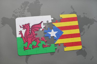 bir dünya haritası arka plan üzerinde galler ve Katalonya ulusal bayrağı ile bulmaca.