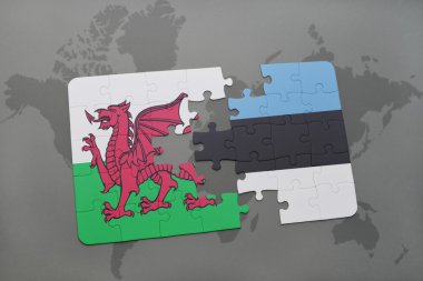 bir dünya haritası arka plan üzerinde galler ve estonya ulusal bayrağı ile bulmaca.