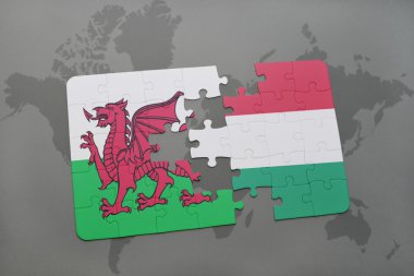 Macaristan ve Galler Ulusal bayrak dünya harita arka plan üzerinde ile bulmaca.