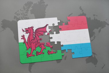 Galler ve Lüksemburg ulusal bayrak dünya harita arka plan üzerinde ile bulmaca.