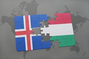 bir dünya haritası arka plan üzerinde İzlanda ve Macaristan ulusal bayrağı ile bulmaca.
