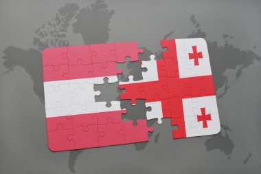 bir dünya haritası arka plan üzerinde Avusturya ve Gürcistan ulusal bayrağı ile bulmaca.