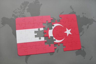 bir dünya haritası arka plan üzerinde Avusturya ve Türkiye'nin ulusal bayrağı ile bulmaca.