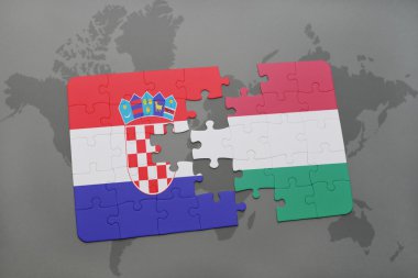 bir dünya haritası arka plan üzerinde Hırvatistan ve Macaristan ulusal bayrağı ile bulmaca.