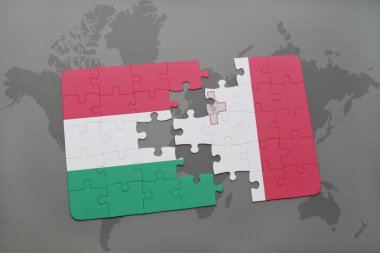 bir dünya haritası arka plan üzerinde Macaristan ve Malta ulusal bayrağı ile bulmaca.