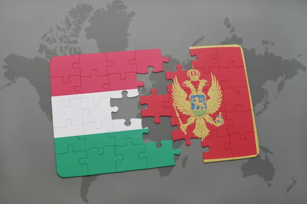 Quebra-cabeça com a bandeira nacional de Hungary e Montenburgh em um fundo de mapa do mundo . — Fotografia de Stock