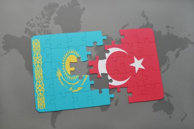 Dünya harita arka plan üzerinde Türkiye ve Kazakistan bayrağı ile bulmaca.