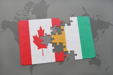 bir dünya haritası arka plan üzerinde kanada ve cote divoire ulusal bayrağı ile bulmaca.