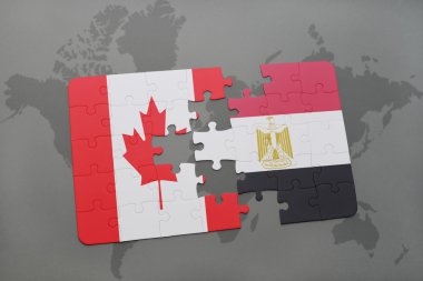 bir dünya haritası arka plan üzerinde Kanada ve Mısır ulusal bayrağı ile bulmaca.