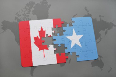 bir dünya haritası arka plan üzerinde Kanada ve Somali ulusal bayrağı ile bulmaca.