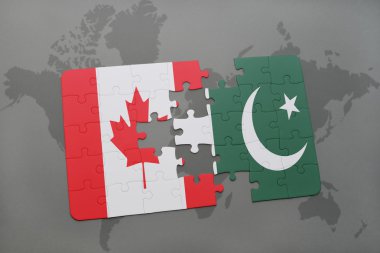 bir dünya haritası arka plan üzerinde Kanada ve Pakistan ulusal bayrağı ile bulmaca.