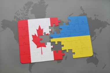 bir dünya haritası arka plan üzerinde Kanada ve Ukrayna ulusal bayrağı ile bulmaca.