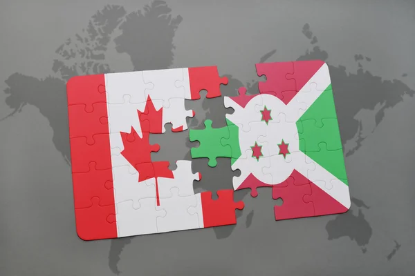 Quebra-cabeça com a bandeira nacional do Canadá e do burundi em um fundo de mapa do mundo . — Fotografia de Stock