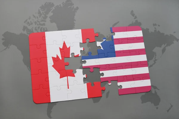 Pussel med den nationella flaggan i Kanada och Liberia på en världskarta bakgrund. — Stockfoto