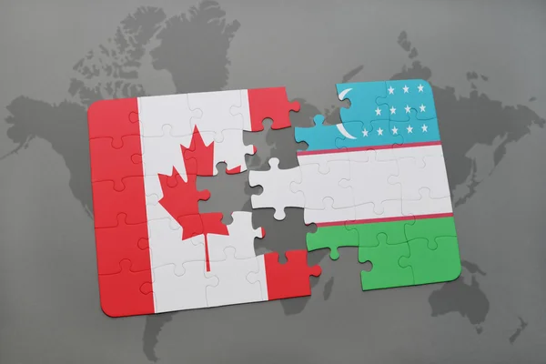 Puzzle con la bandiera nazionale del Canada e uzbekistan su uno sfondo mappa del mondo . — Foto Stock