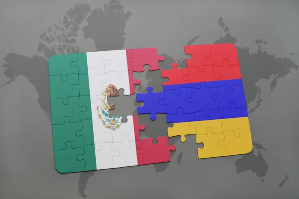 Quebra-cabeça com a bandeira nacional do méxico e armenia em um fundo de mapa do mundo . — Fotografia de Stock