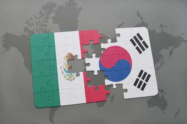 Puzzle with the national flag of mexico and south korea on a world map background. — Stock Photo, Image