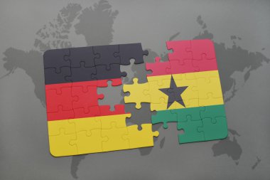 bir dünya haritası arka plan üzerinde Almanya ve Gana ulusal bayrağı ile bulmaca.