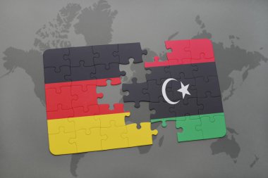 bir dünya haritası arka plan üzerinde Almanya ve Libya ulusal bayrağı ile bulmaca.