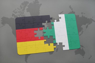 bir dünya haritası arka plan üzerinde Almanya ve Nijerya ulusal bayrağı ile bulmaca.