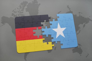 bir dünya haritası arka plan üzerinde Almanya ve Somali ulusal bayrağı ile bulmaca.