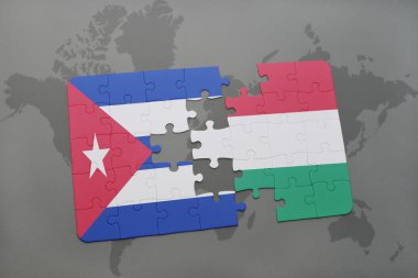 bir dünya haritası arka plan üzerinde Küba ve Macaristan ulusal bayrağı ile bulmaca.