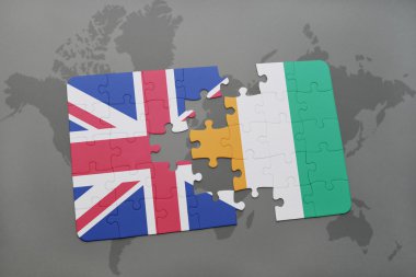 bir dünya haritası arka plan üzerinde büyük Britanya ve cote divoire ulusal bayrağı ile bulmaca.
