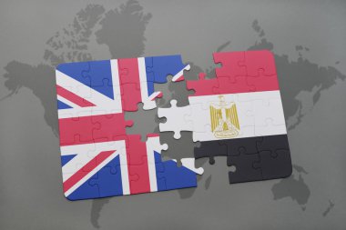 bir dünya haritası arka plan üzerinde büyük Britanya ve Mısır ulusal bayrağı ile bulmaca.