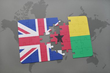 bir dünya haritası arka plan üzerinde büyük Britanya ve gine bissau ulusal bayrağı ile bulmaca.