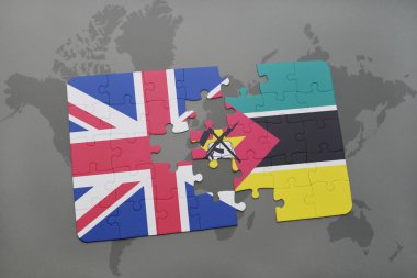 bir dünya haritası arka plan üzerinde büyük Britanya ve mozambik ulusal bayrağı ile bulmaca.