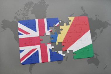 bir dünya haritası arka plan üzerinde büyük Britanya ve seyşeller ulusal bayrağı ile bulmaca.