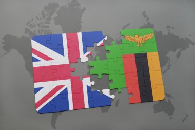 bir dünya haritası arka plan üzerinde büyük Britanya ve zambiya ulusal bayrağı ile bulmaca.