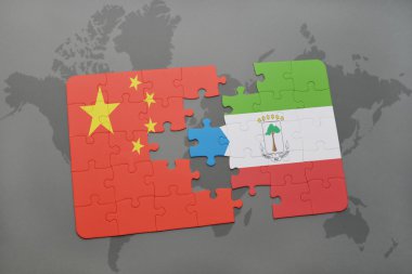 bir dünya haritası arka plan üzerinde çin ve ekvator ginesi ulusal bayrağı ile bulmaca.