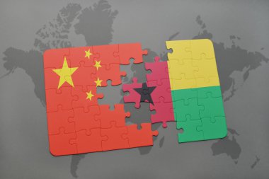 bir dünya haritası arka plan üzerinde çin ve gine bissau ulusal bayrağı ile bulmaca.