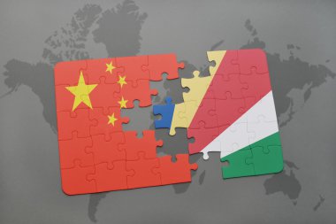 bir dünya haritası arka plan üzerinde çin ve seyşeller ulusal bayrağı ile bulmaca.