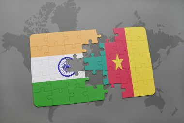 bir dünya haritası arka plan üzerinde Hindistan ve Kamerun ulusal bayrağı ile bulmaca.