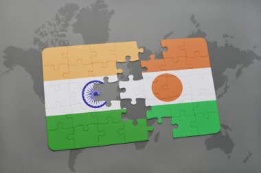 bir dünya haritası arka plan üzerinde hindistan ve nijer ulusal bayrağı ile bulmaca.