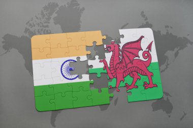 bir dünya haritası arka plan üzerinde Hindistan ve Galler ulusal bayrağı ile bulmaca.