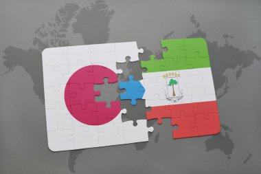 bir dünya haritası arka plan üzerinde Japonya ve ekvator ginesi ulusal bayrağı ile bulmaca.