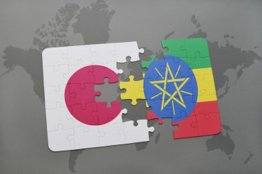bir dünya haritası arka plan üzerinde Japonya ve Etiyopya ulusal bayrağı ile bulmaca.