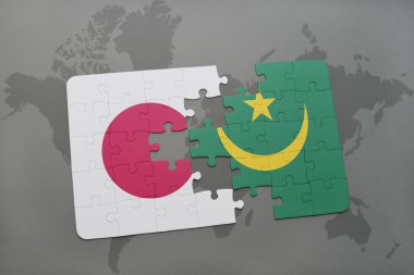 bir dünya haritası arka plan üzerinde Japonya ve Moritanya ulusal bayrağı ile bulmaca.