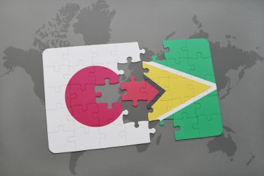 bir dünya haritası arka plan üzerinde japonya ve guyana ulusal bayrağı ile bulmaca.