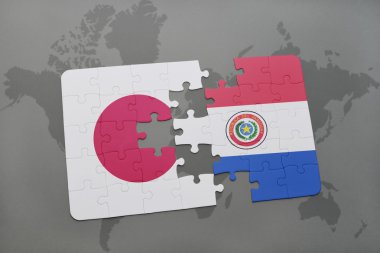 bir dünya haritası arka plan üzerinde Japonya ve Paraguay ulusal bayrağı ile bulmaca.