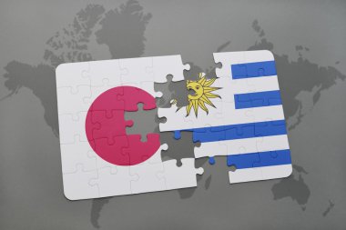 bir dünya haritası arka plan üzerinde Japonya ve Uruguay ulusal bayrağı ile bulmaca.
