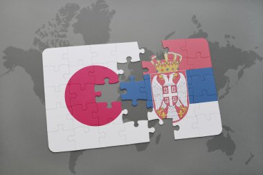 bir dünya haritası arka plan üzerinde Japonya ve Sırbistan ulusal bayrağı ile bulmaca.