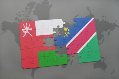 bir dünya haritası arka plan üzerinde umman ve namibya ulusal bayrağı ile bulmaca.