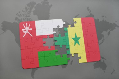bir dünya haritası arka plan üzerinde umman ve senegal ulusal bayrağı ile bulmaca.