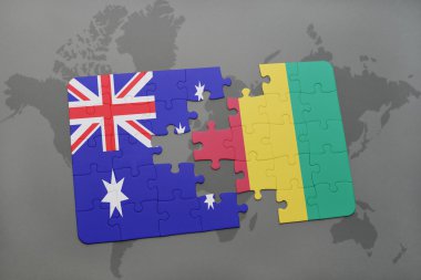 bir dünya haritası arka plan üzerinde Avustralya ve Gine ulusal bayrağı ile bulmaca.