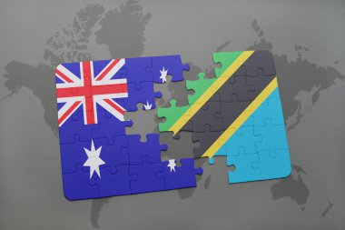 bir dünya haritası arka plan üzerinde Avustralya ve Tanzanya ulusal bayrağı ile bulmaca.